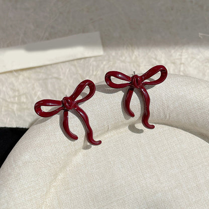 Khas Maroon bow' studs